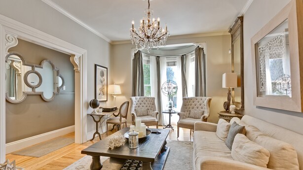 A spacious living room with a large chandelier, a sofa, armchairs, and a coffee table. - ❤️BEST LOCATION-WALK TO EVERYTHING❤️ (San Francisco)