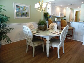 Enjoy meals in this cozy dining area with a round table and comfortable seating for four.