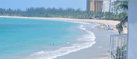 On the beach, sun loungers, beach towels