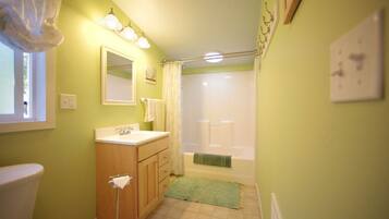 Combined shower/tub, hair dryer, towels, soap
