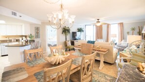 A spacious living room with a dining area, a kitchen, and a TV. - LABOR DAY Still Available & Discounted~BOOK A LAST MIN VACAY~Phoenix East~3BR2B (Orange Beach)