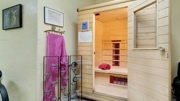 Features a space with a shelf, towel, and storage rack.