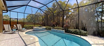 Two Master Bedrooms! Less than 1 Mile to the beach with heated pool and spa