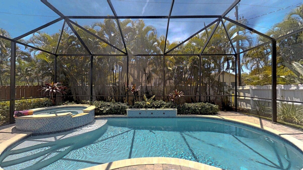 Two Master Bedrooms! Less than 1 Mile to the beach with heated pool and spa