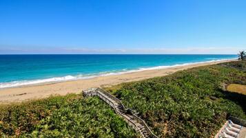 On the beach, sun loungers, beach towels