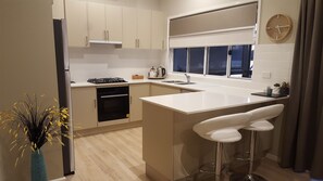 Riverview Cottage | Private kitchen | Fridge, microwave, coffee/tea maker, electric kettle
