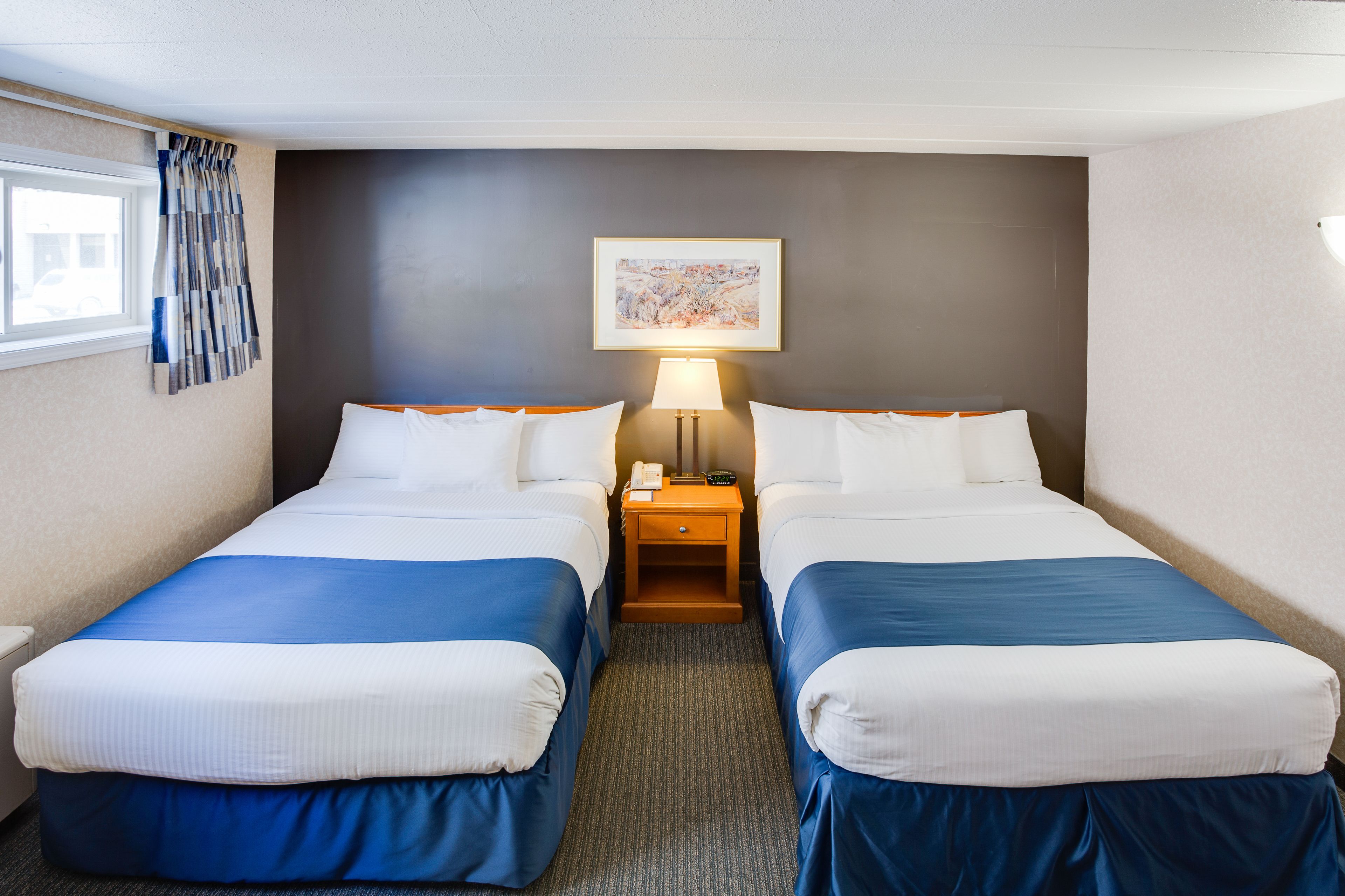 economy room, 2 queen beds (obstructed view) | desk, blackout curtains, soundproofing, iron/ironing board