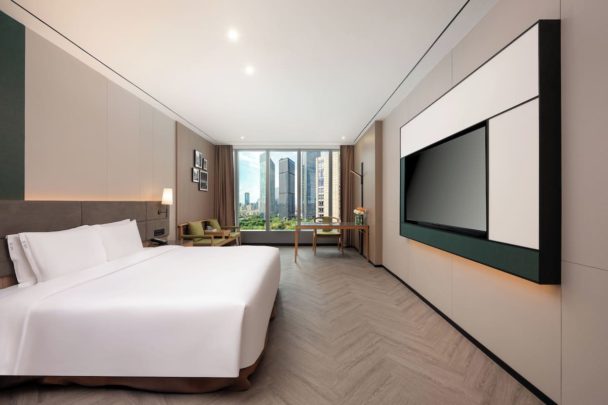 Premium Room, 1 King Bed, Garden View | 1 bedroom, down duvets, free minibar, in-room safe