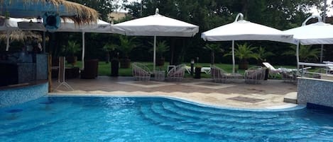 Outdoor pool, pool umbrellas, sun loungers