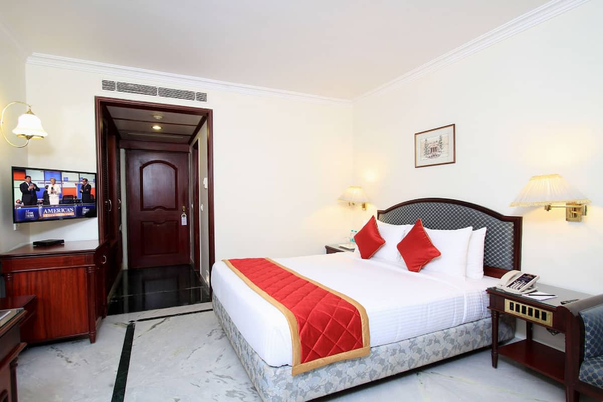 Premium bedding, desk, laptop workspace, blackout curtains