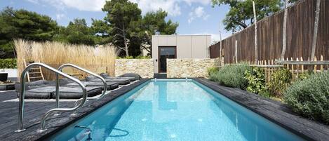 Seasonal outdoor pool, open 8:30 AM to 8 PM, pool umbrellas