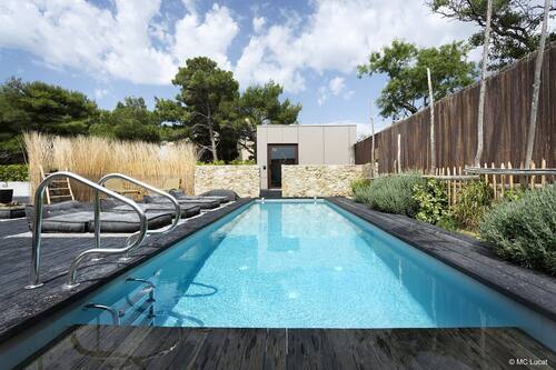 Seasonal outdoor pool, open 8:30 AM to 8 PM, pool umbrellas