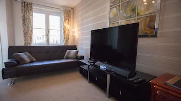 Executive House, 3 Bedrooms | Living area | Flat-screen TV
