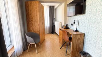 Hypo-allergenic bedding, desk, laptop workspace, blackout curtains