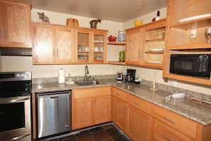 Condo, 2 Bedrooms | Private kitchen | Full-size fridge, microwave, oven, stovetop
