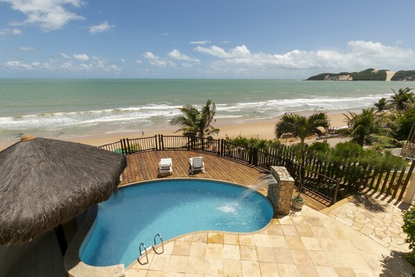 Superior Apartment, 1 Bedroom, Refrigerator & Microwave, Ocean View | Pool | Outdoor pool, open 6:00 AM to 9:00 PM, pool loungers