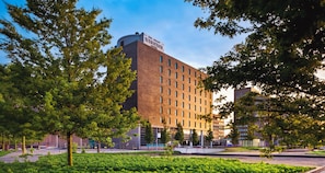 Surrounded by lush greenery, this hotel offers a contemporary design with a functional layout.