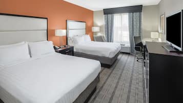 Premium bedding, desk, laptop workspace, blackout drapes