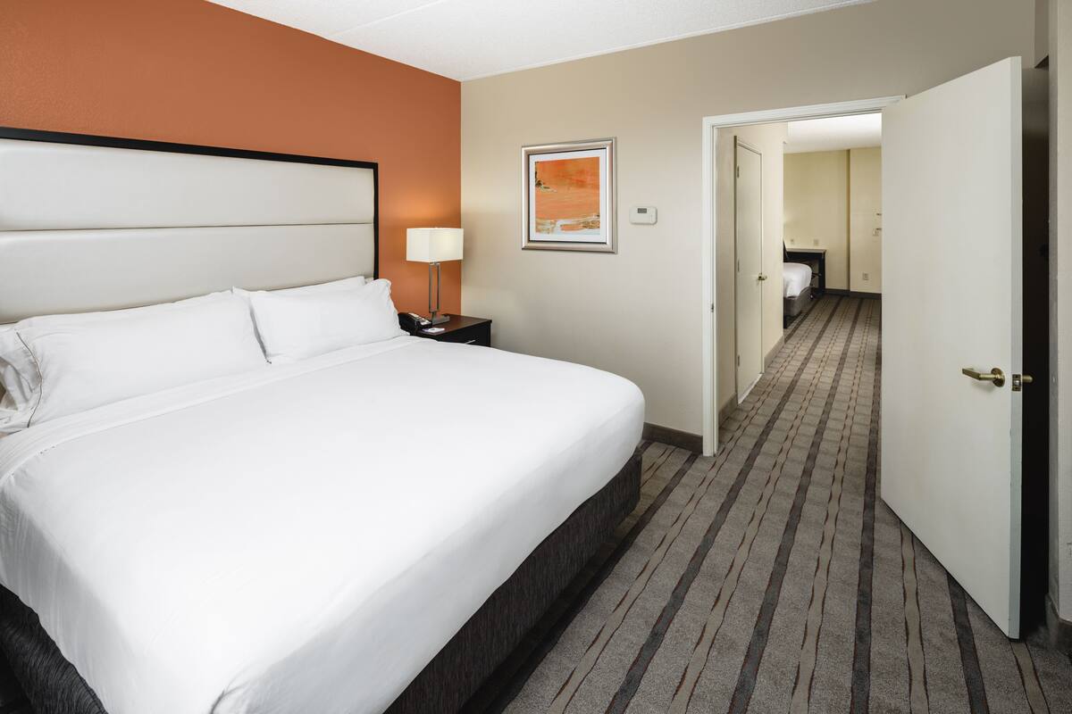 Premium bedding, desk, laptop workspace, blackout curtains