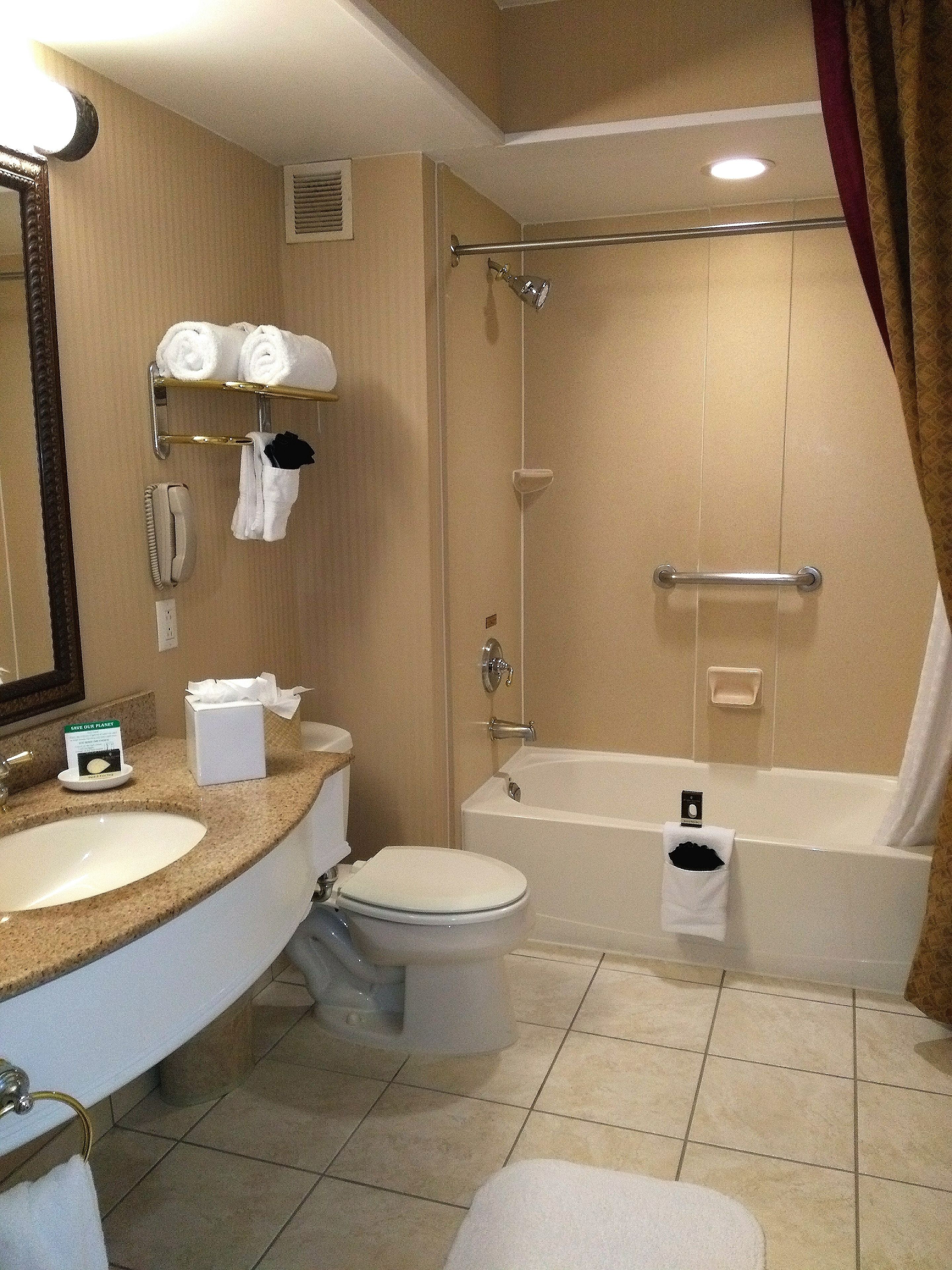 superior room, 1 king bed with sofa bed | bathroom | free toiletries, hair dryer, slippers, towels