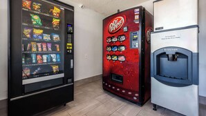 A vending machine area with a Dr. Pepper machine and a water dispenser. - Motel 6 Fort Worth, TX - East (Fort Worth)
