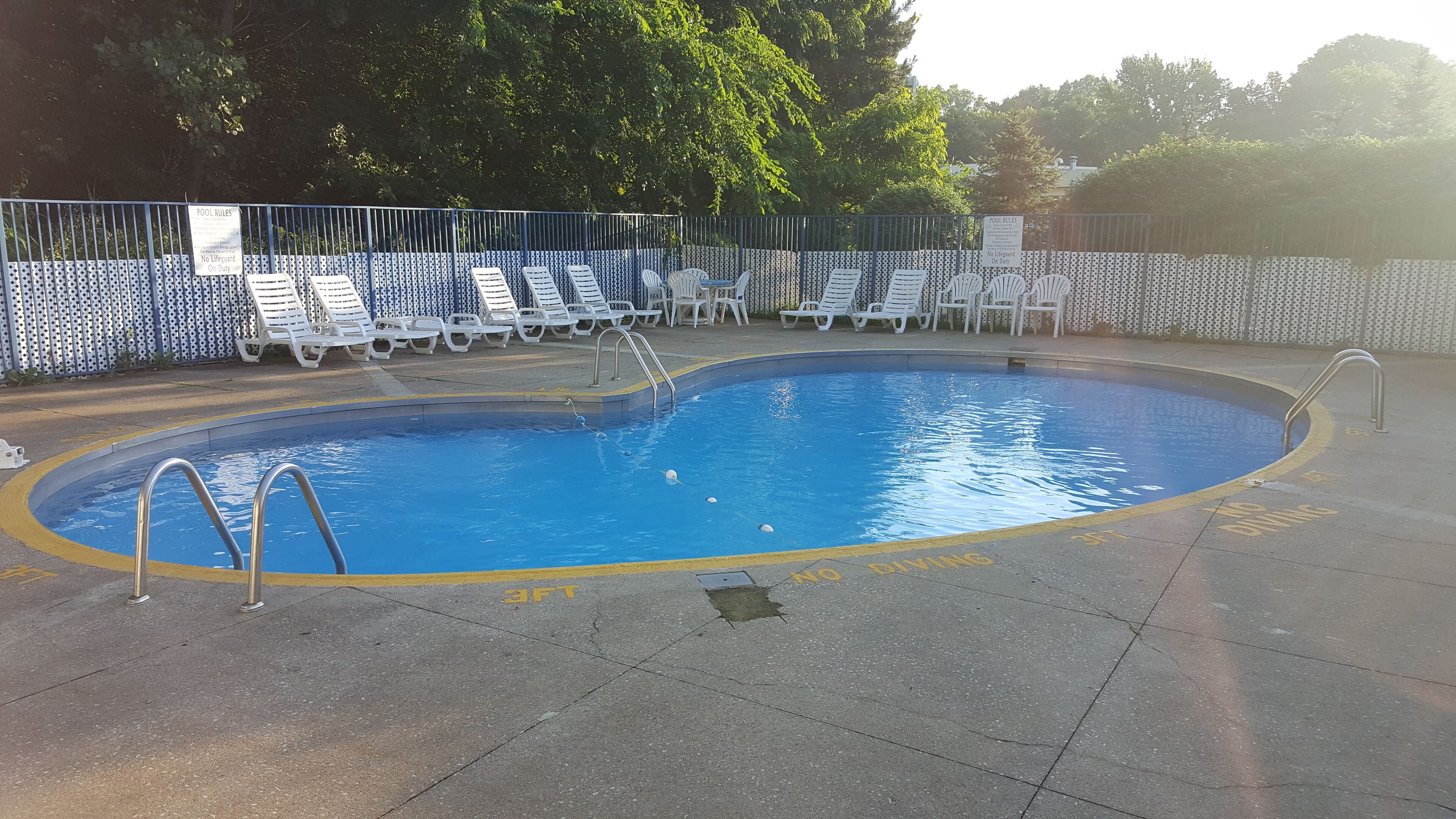 Seasonal outdoor pool, open 9:00 AM to 8:00 PM, pool loungers