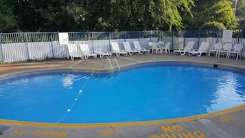 Seasonal outdoor pool, open 9:00 AM to 8:00 PM, pool loungers