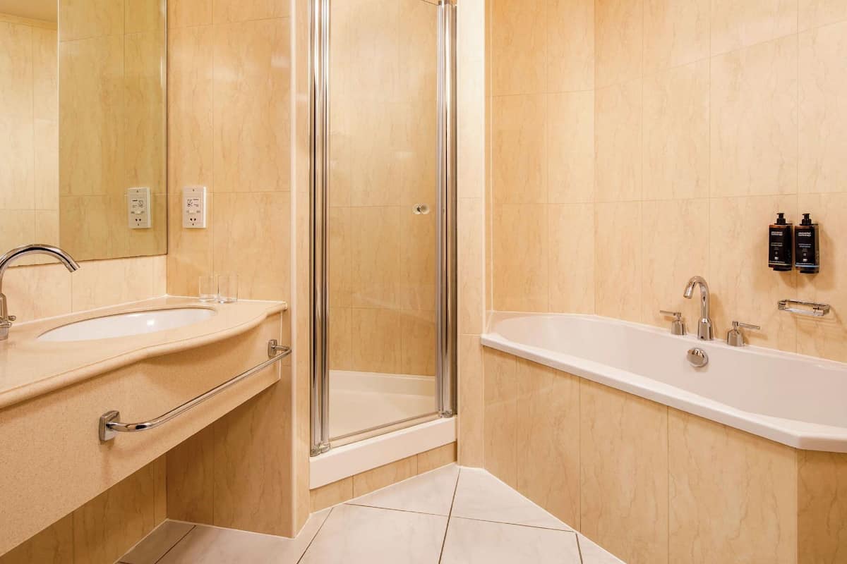 separate bathtub and shower, deep-soaking bathtub