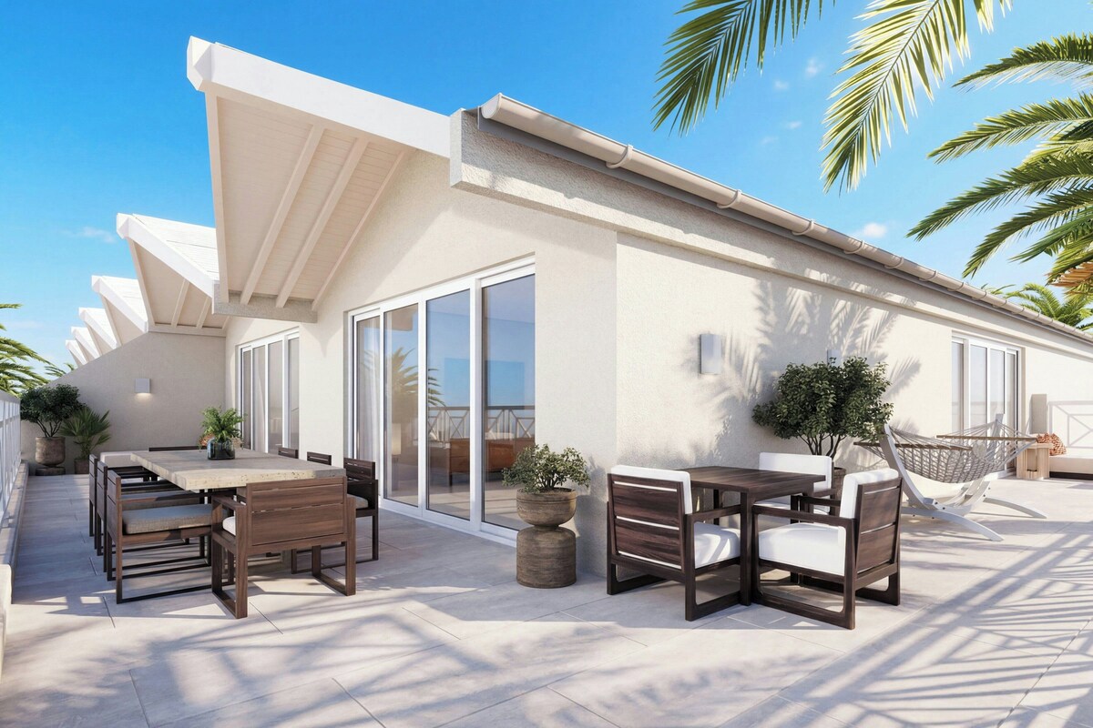 A modern outdoor patio with a dining area, a hammock, and potted plants.