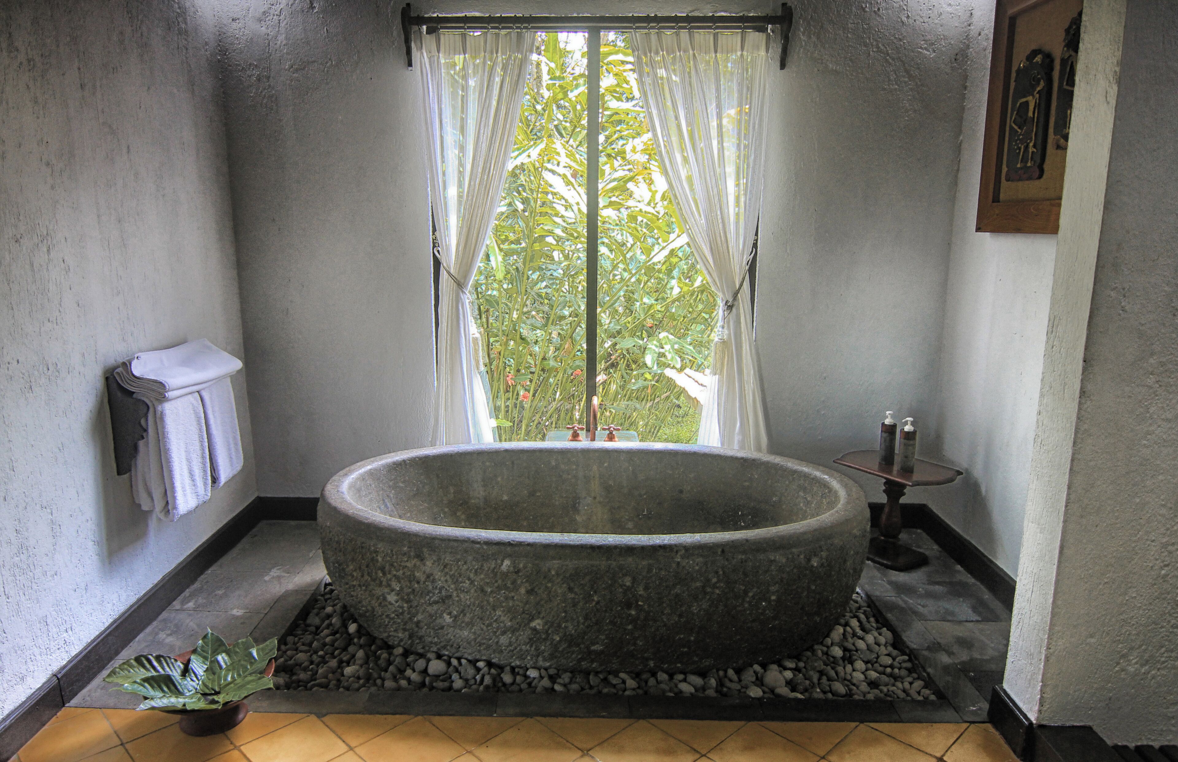 arum villa (mountain or garden view) | bathroom | combined shower/bathtub, deep-soaking bathtub, rainfall showerhead