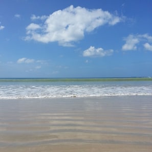 On the beach, sun loungers, beach bar