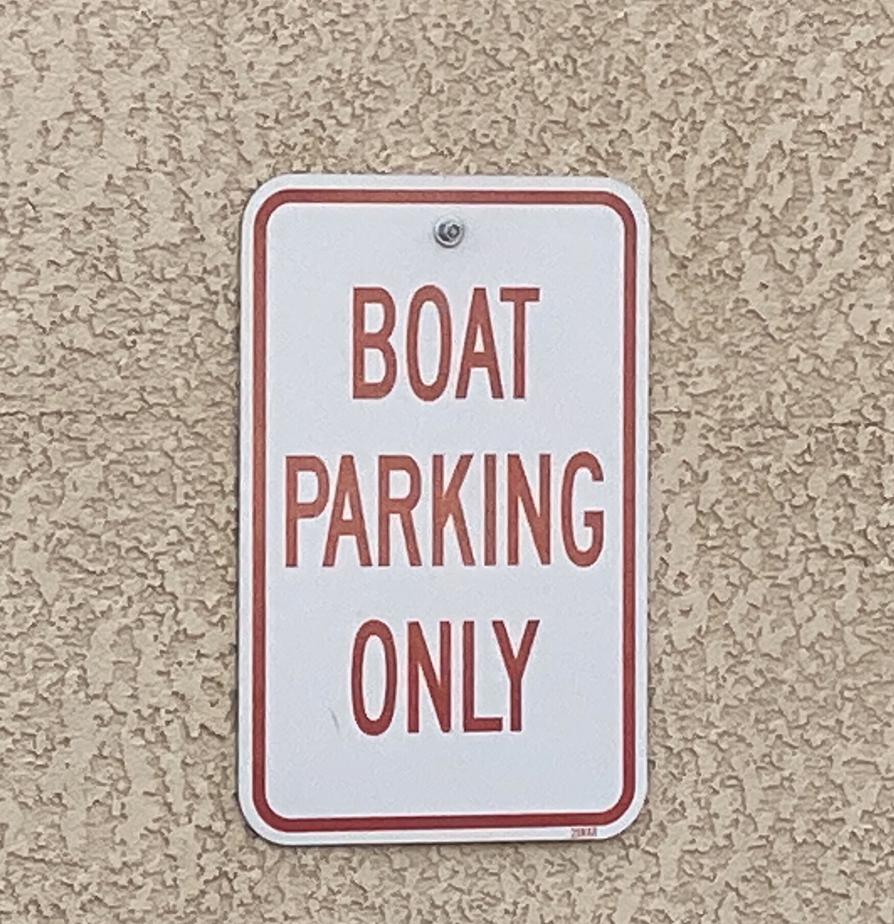A sign indicating boat parking only.