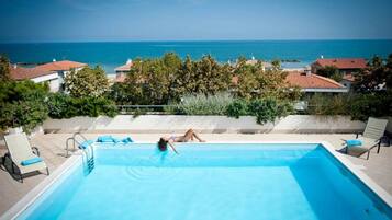 Seasonal outdoor pool, pool umbrellas, sun loungers