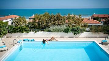 Seasonal outdoor pool, pool umbrellas, sun loungers