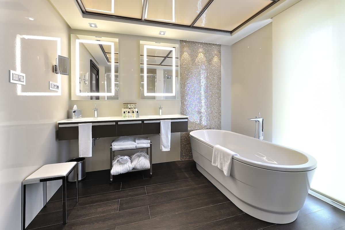 separate bathtub and shower, rainfall showerhead, hair dryer, bathrobes