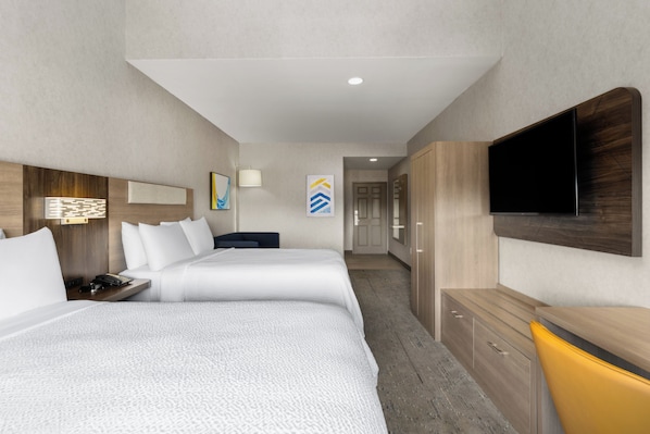 A hotel room with two beds, a TV, a desk, and a wardrobe. - Holiday Inn Express Hotel & Suites Manteca by IHG (Manteca)