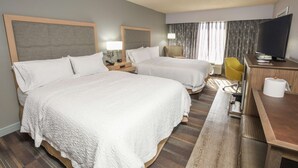 A hotel room with two beds, a desk with a television, and a chair. - Hampton Inn Jacksonville East Regency Square (Jacksonville)
