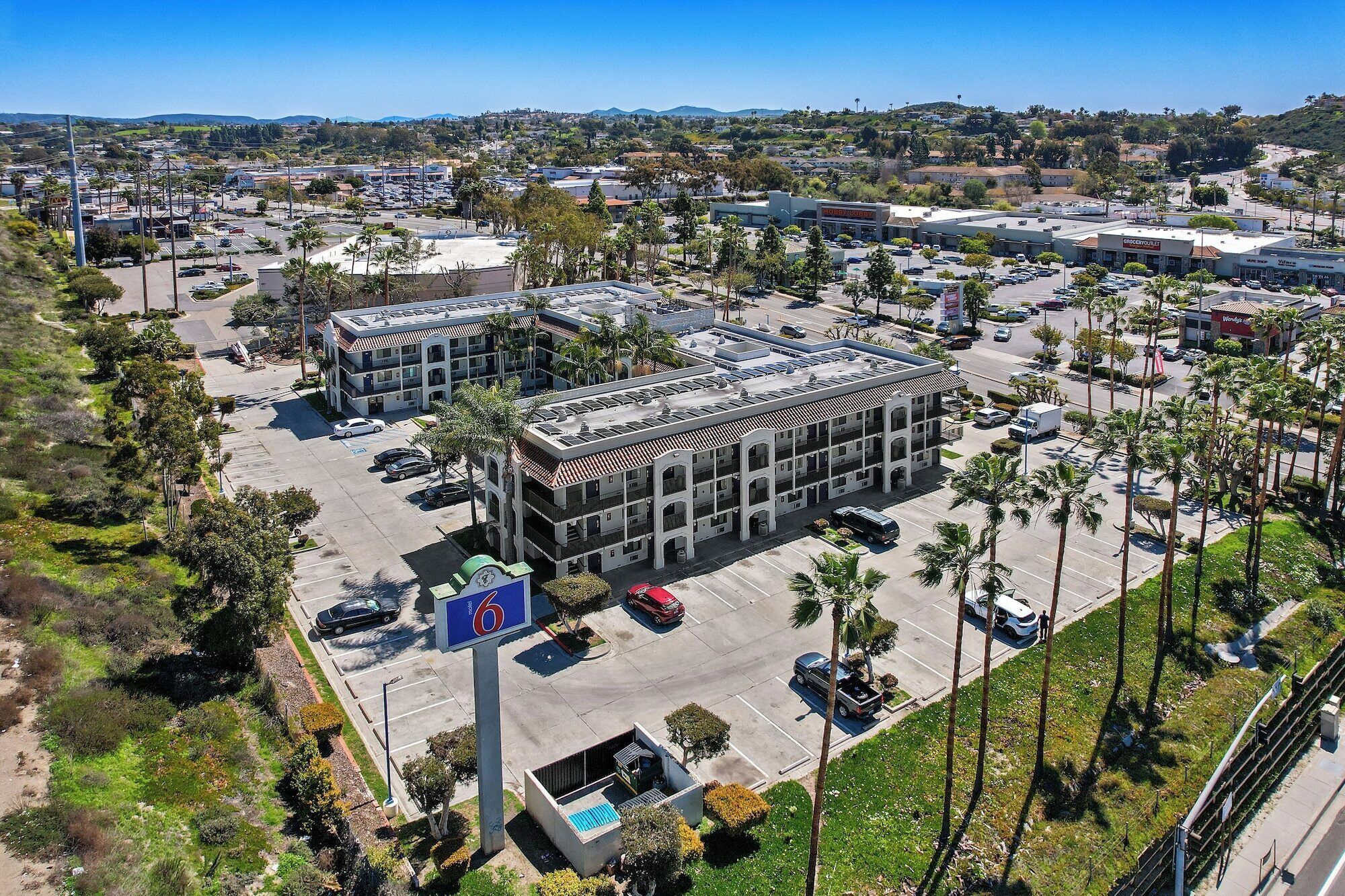 A multi-story parking garage with a central atrium and multiple parking levels.