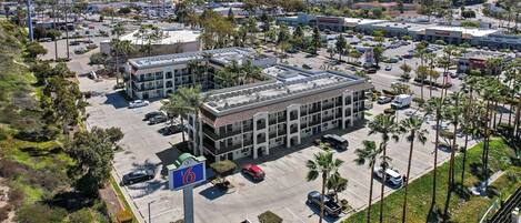 A multi-story parking garage with a central atrium and multiple parking levels.