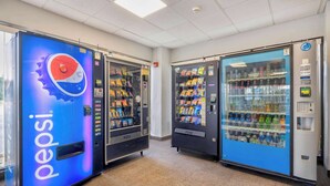 A row of vending machines in a commercial setting, including a Pepsi machine and a water dispenser. - Motel 6 Villa Park, IL - Chicago West (Villa Park)