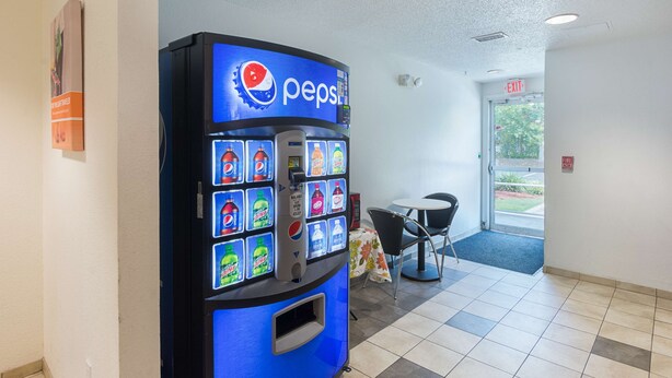 A vending machine with a Pepsi logo, various drink options, and a digital display. - Motel 6 Columbia, SC - Fort Jackson Area (Columbia)