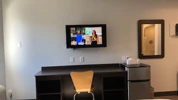 Desk, laptop workspace, blackout curtains, iron/ironing board