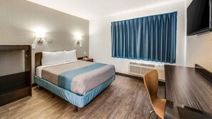 Desk, laptop workspace, blackout drapes, iron/ironing board