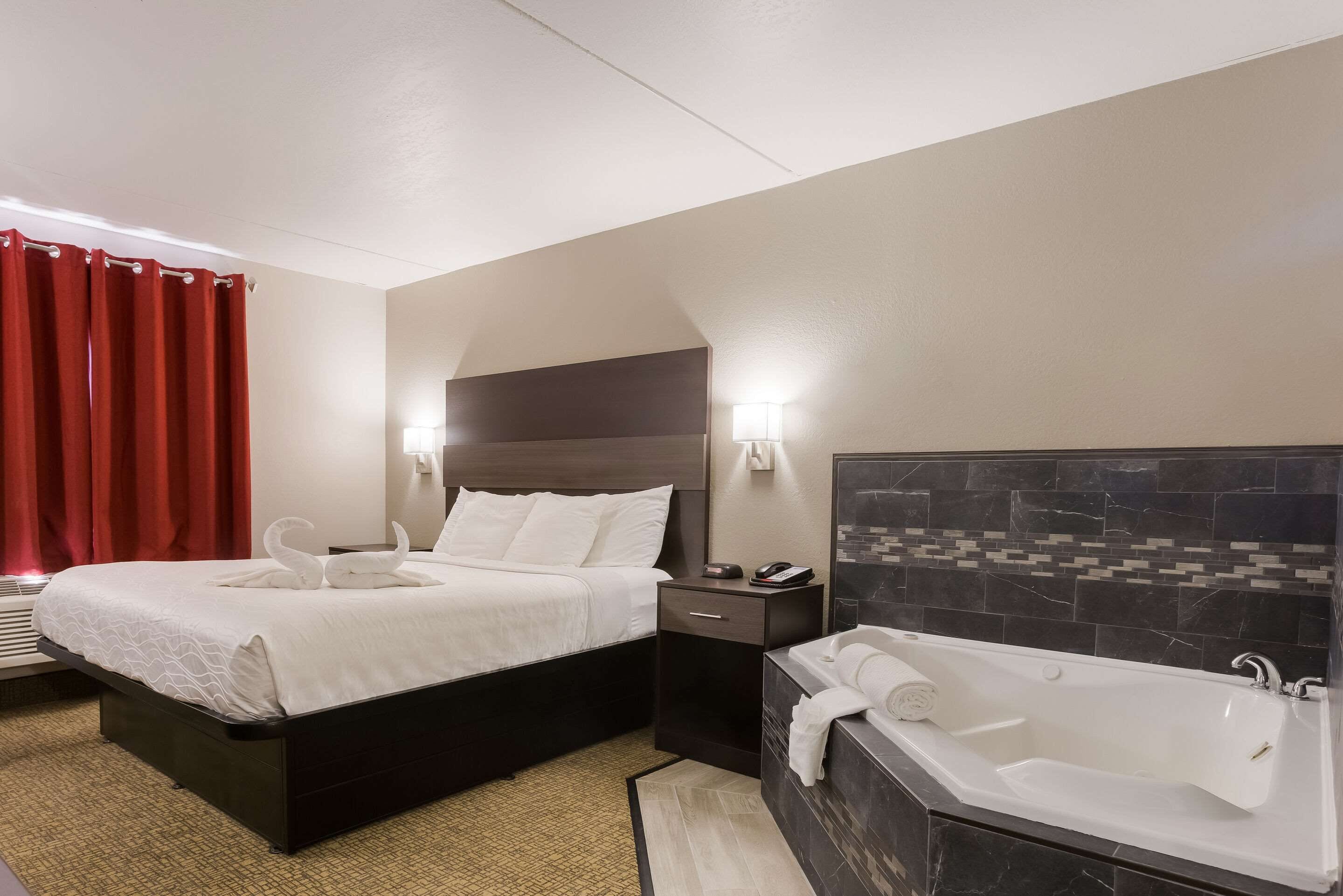 room, 1 king bed, non smoking, hot tub | laptop workspace, iron/ironing board, rollaway beds, free wifi