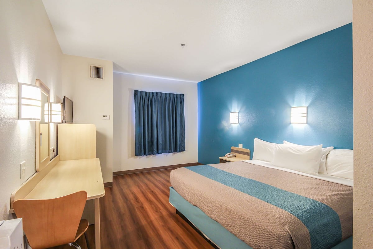 Desk, laptop workspace, blackout curtains, free WiFi