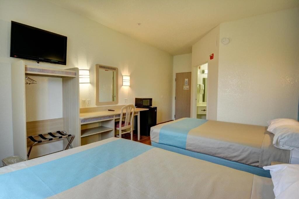 Pillow-top beds, desk, laptop workspace, blackout curtains