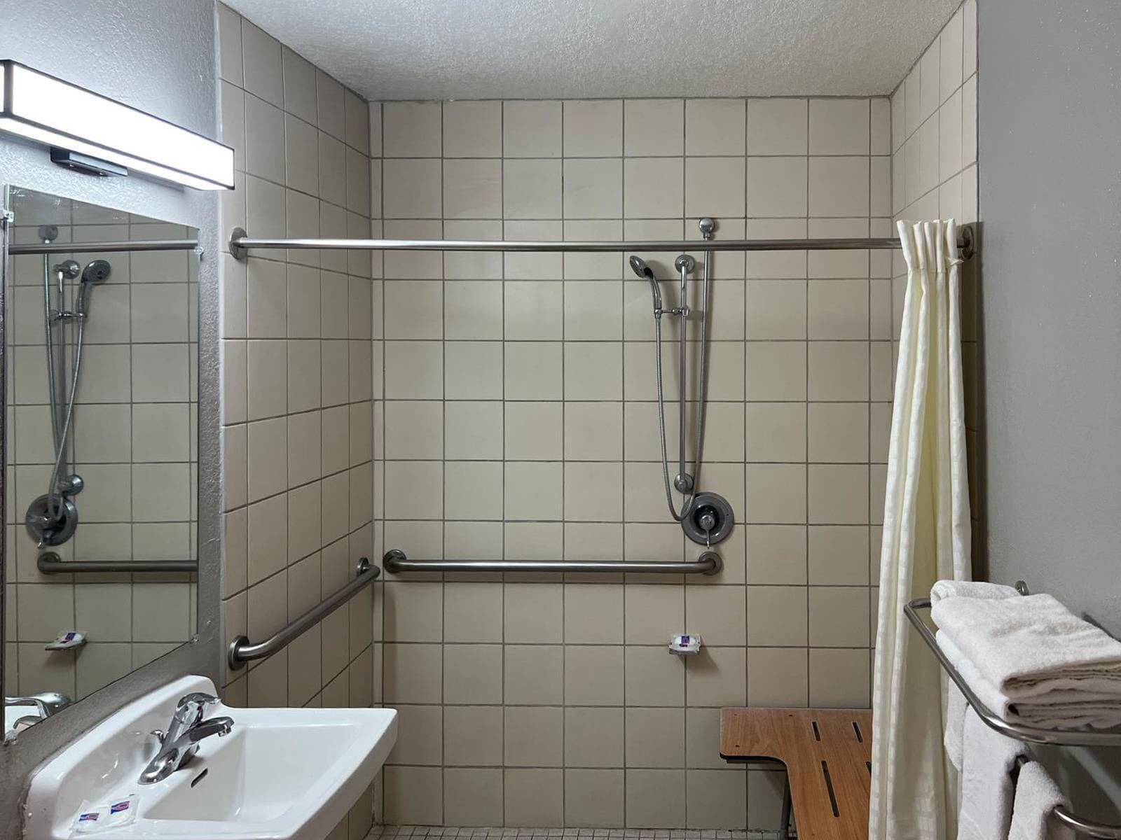 Separate tub and shower, rainfall showerhead, towels, soap