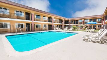 Seasonal outdoor pool, open 9:00 AM to 9:30 PM, pool umbrellas