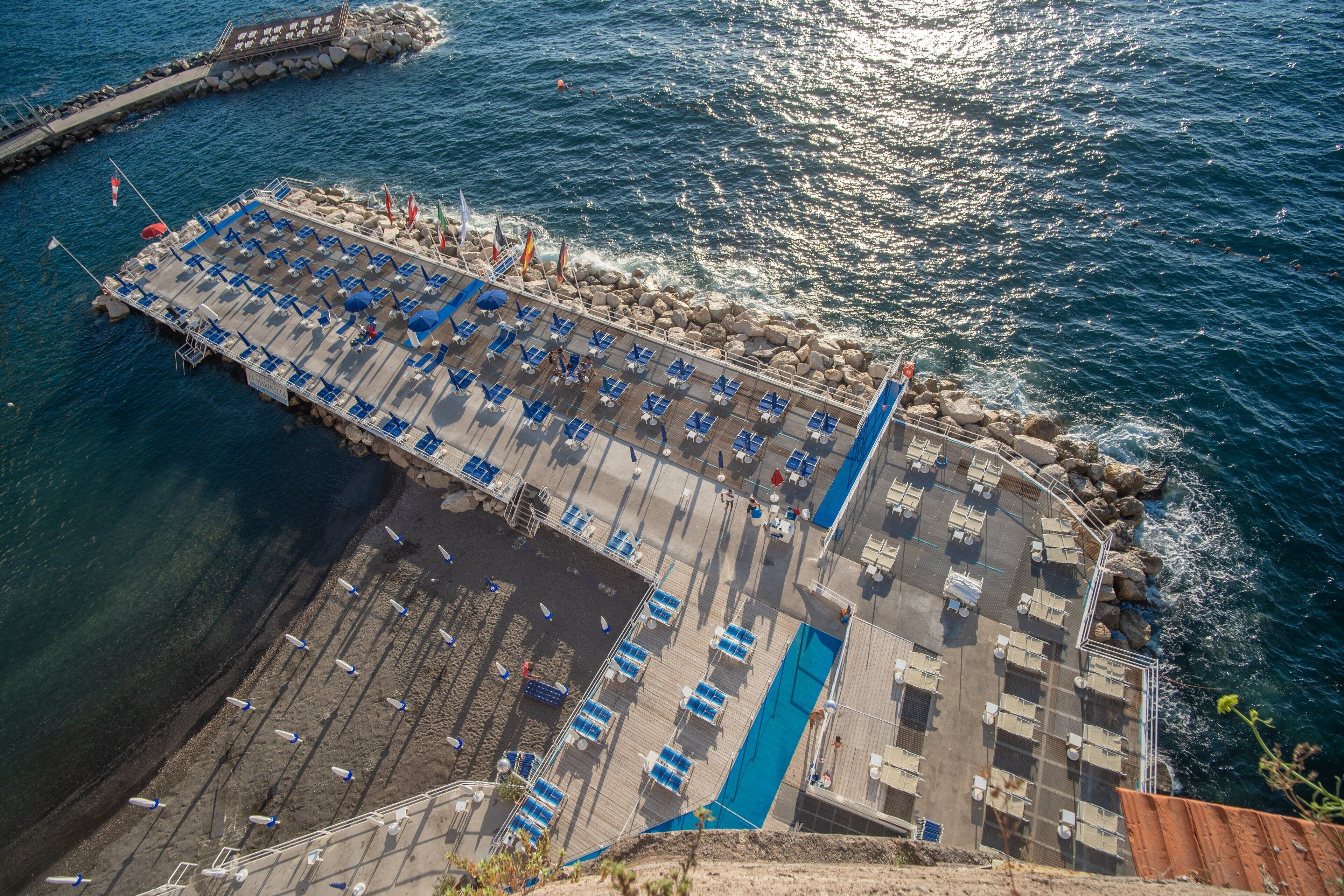 on the beach, black sand, motor boating