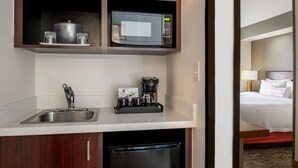 A compact hotel kitchenette with a microwave, coffee maker, and sink. - SpringHill Suites by Marriott Portland Airport (Portland)